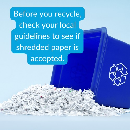 Shredded paper in a recycling bin, with a reminder to check local guidelines to see if shredded paper is accepted. 